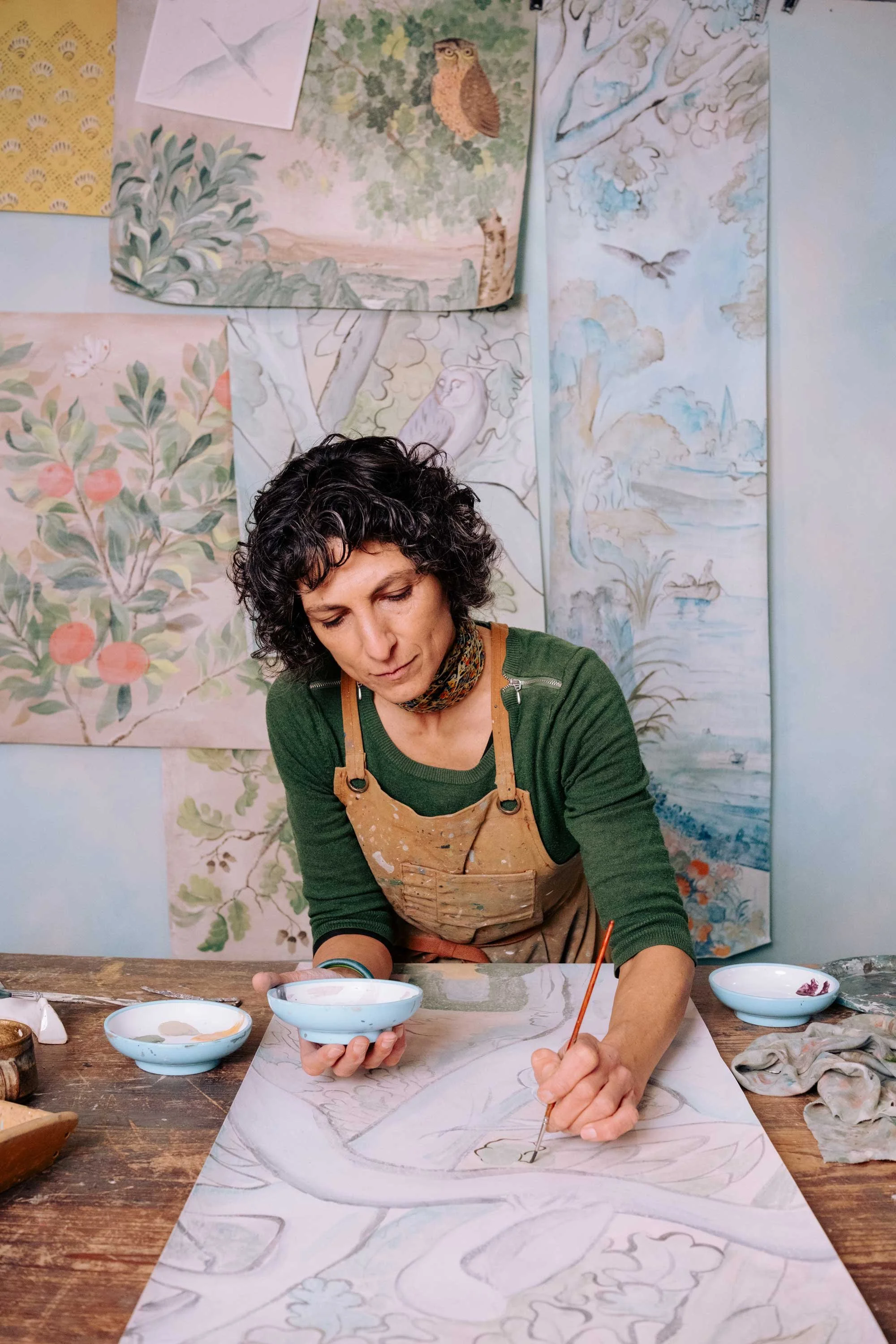 Melissa White at her Hastings studio painting a hand-painted sample of the Glimpses of Thyme design. Photo credit Kerrie Wood Photography