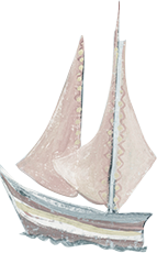 Close-up of a detailed model sailboat with white sails and a wooden hull