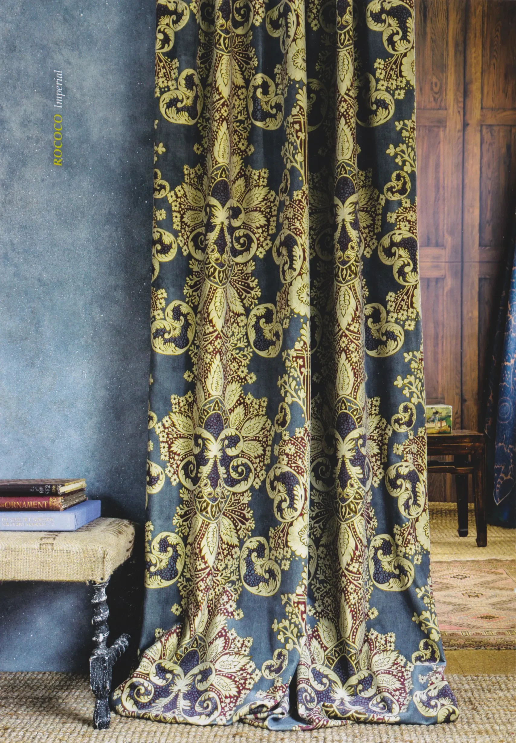 A blue and gold curtain in the Rococo pattern by Melissa White for Lewis & Wood.