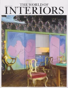 Cover of The World of Interiors magazine featuring a painted interior with ornate chairs and transparent curtains.