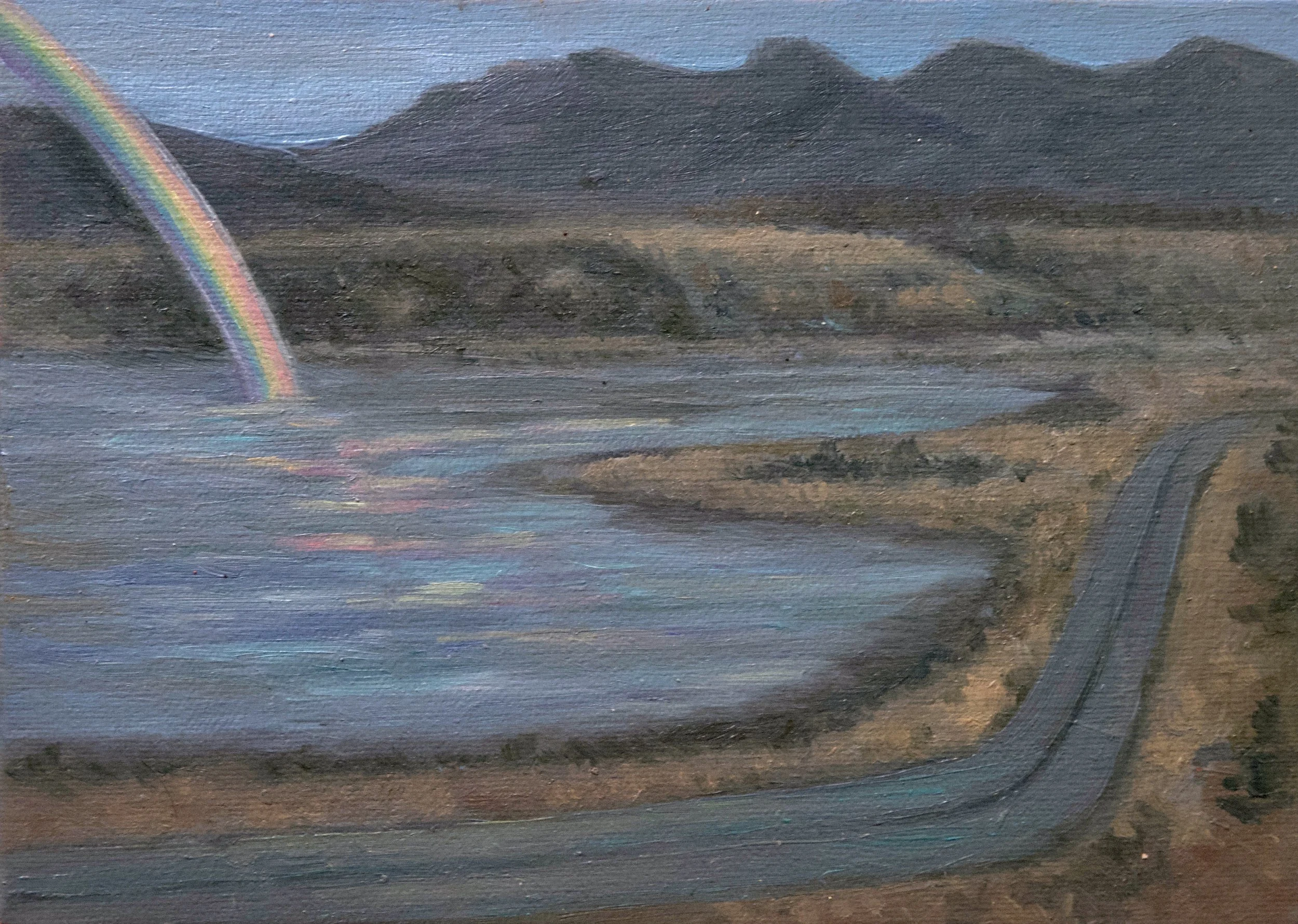 A painting depicts a landscape scene with dark mountains in the background, a blue sky, a rainbow on the left side, and a body of water in the foreground reflecting the colors.