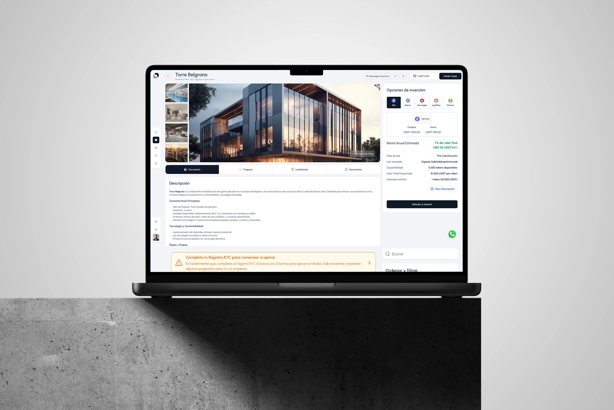 Laptop displaying a real estate website with an image of a modern building, property details, pricing, and investment options.