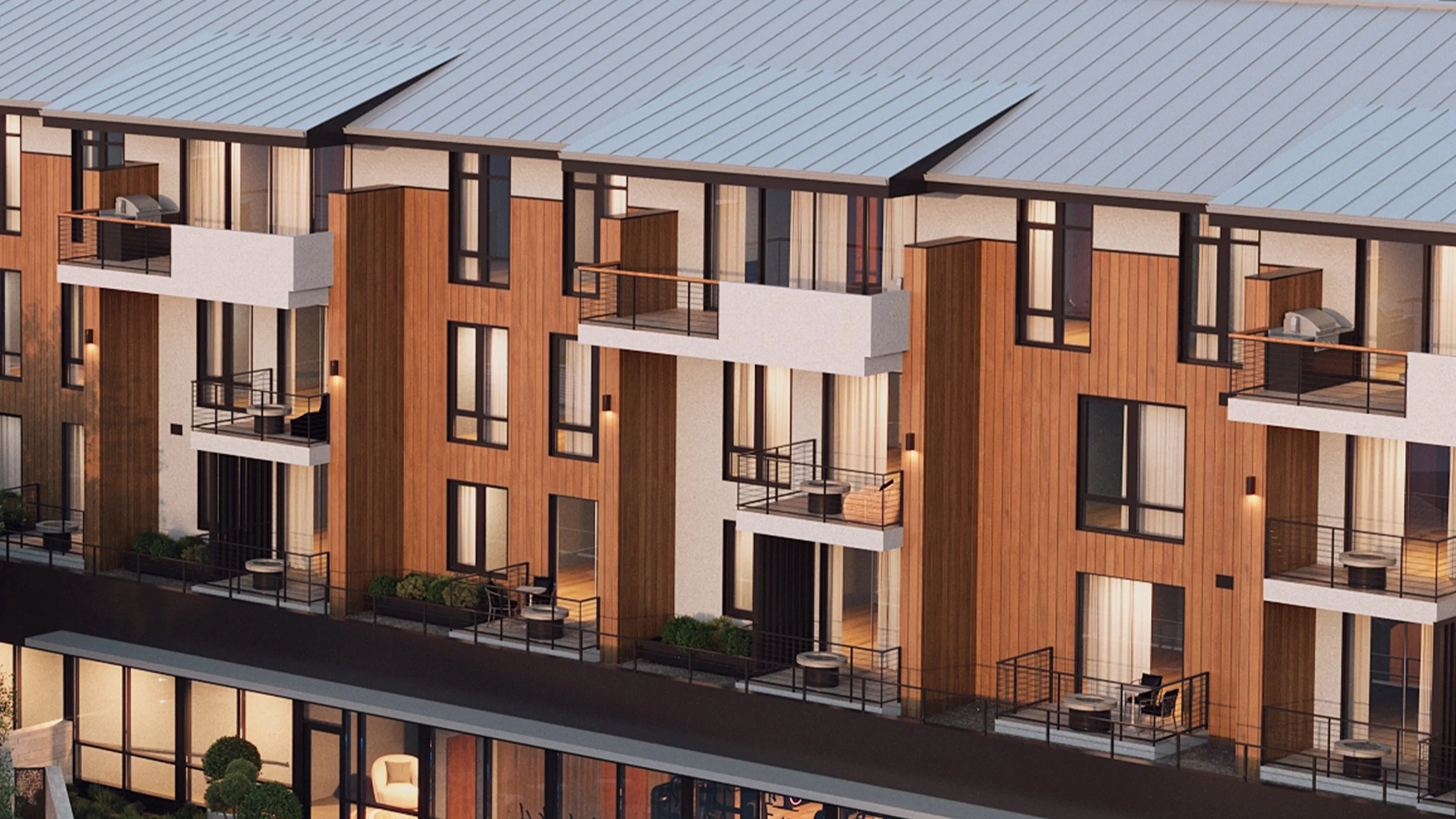 Modern multi-story apartment building with wooden and white exterior, multiple balconies with black railings, large windows, and a metal roof.