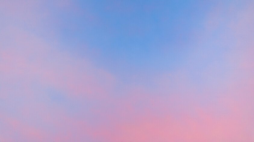 A sky with pastel colors blending pink and blue with a gradient effect.