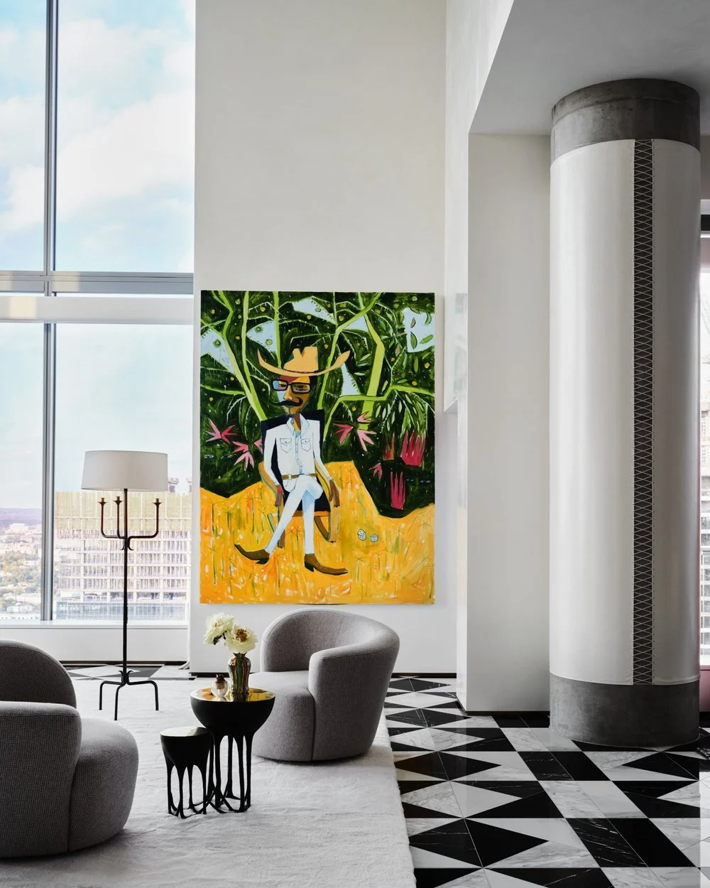 A bold painting by Cruz Ortiz dominates the wall of an AD100 designed penthouse in downtown Austin. Black and white marble floors, contemporary furniture, soaring windows. Dylan Turk