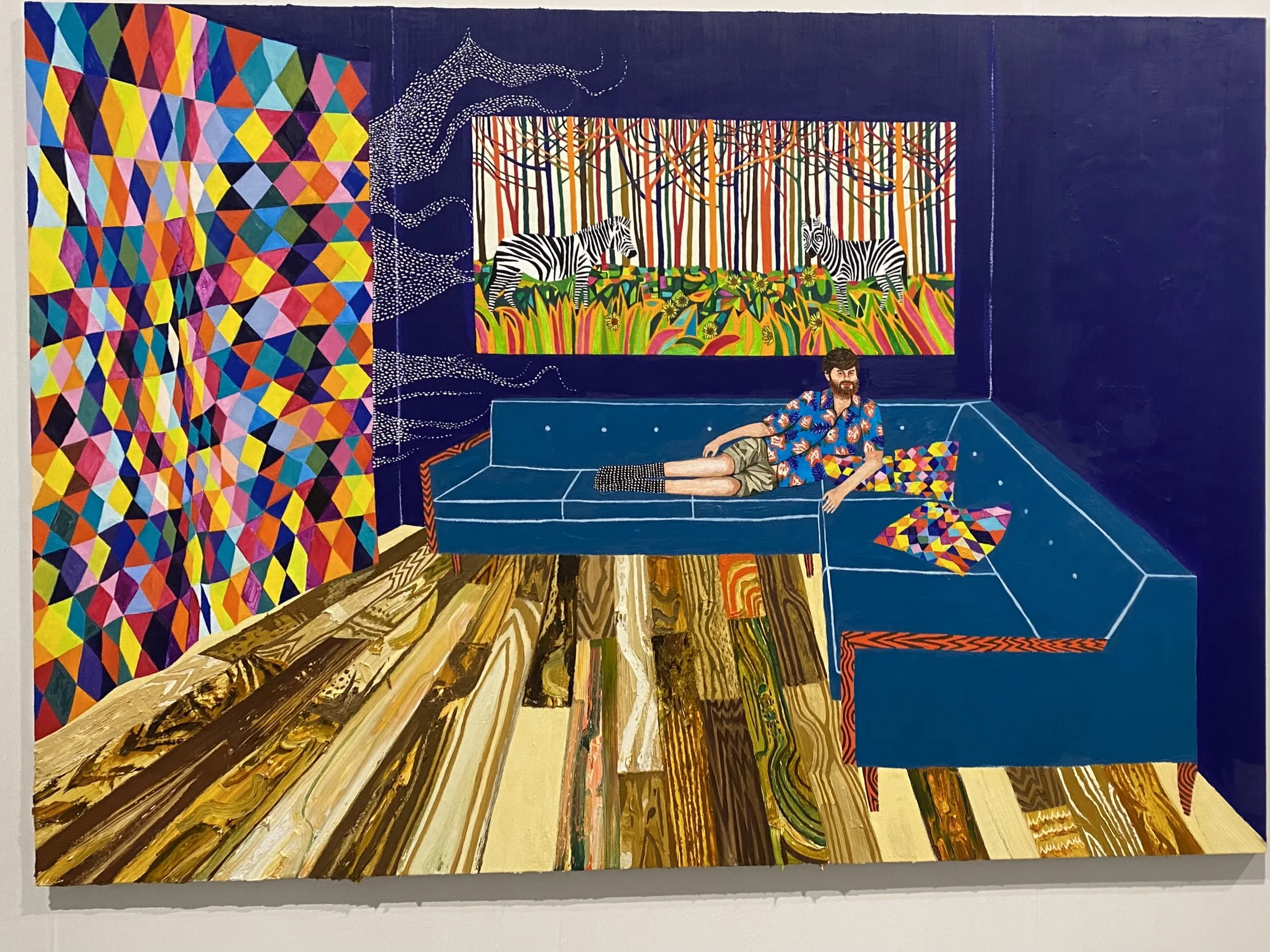 Colorful modern art piece with geometric shapes, painted man lying on a painted sofa, animals zebras in a nature scene, and abstract patterns with bright colors.