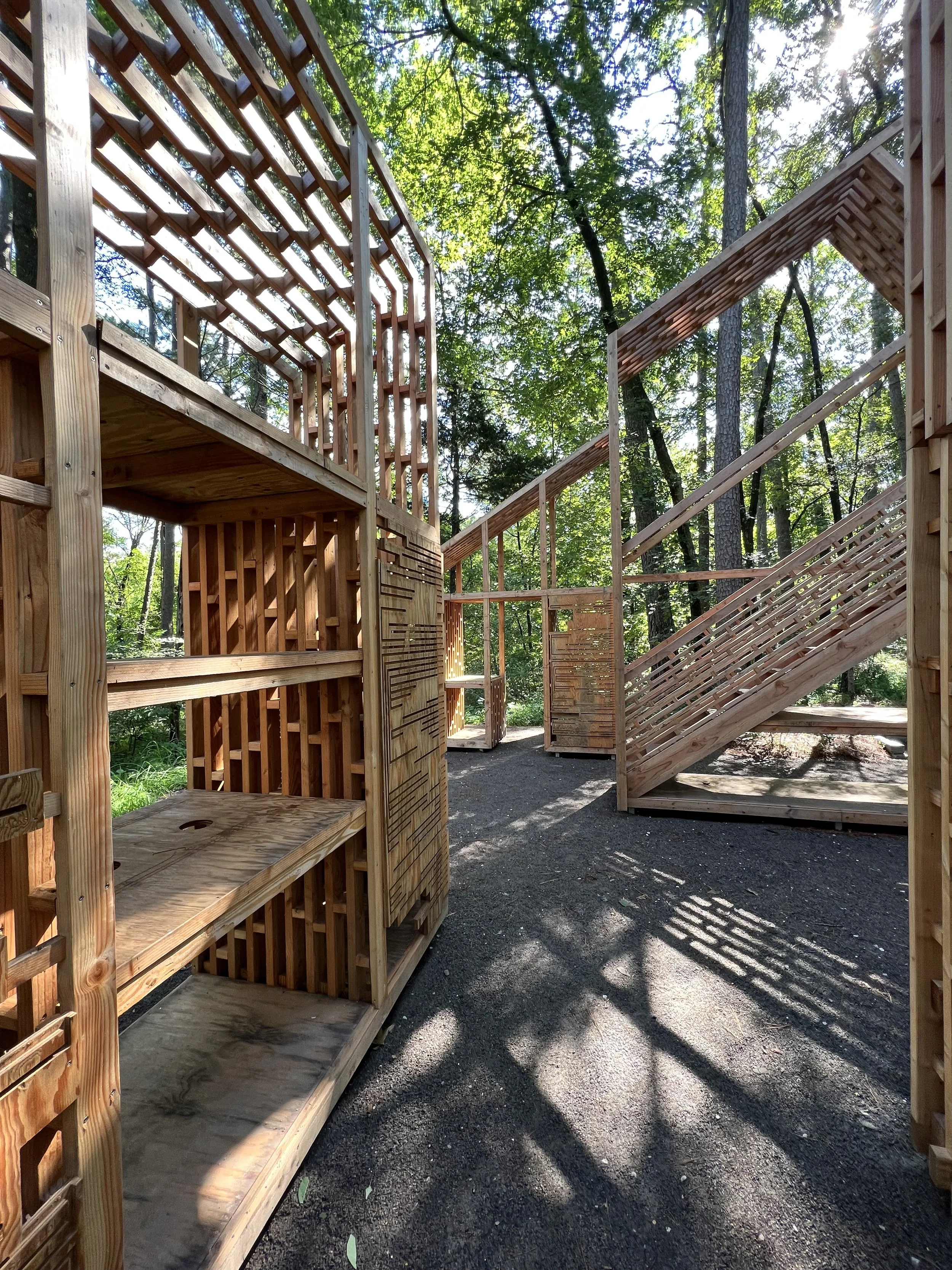 Detail of modular wooden structures referencing the shape and typology of a house.