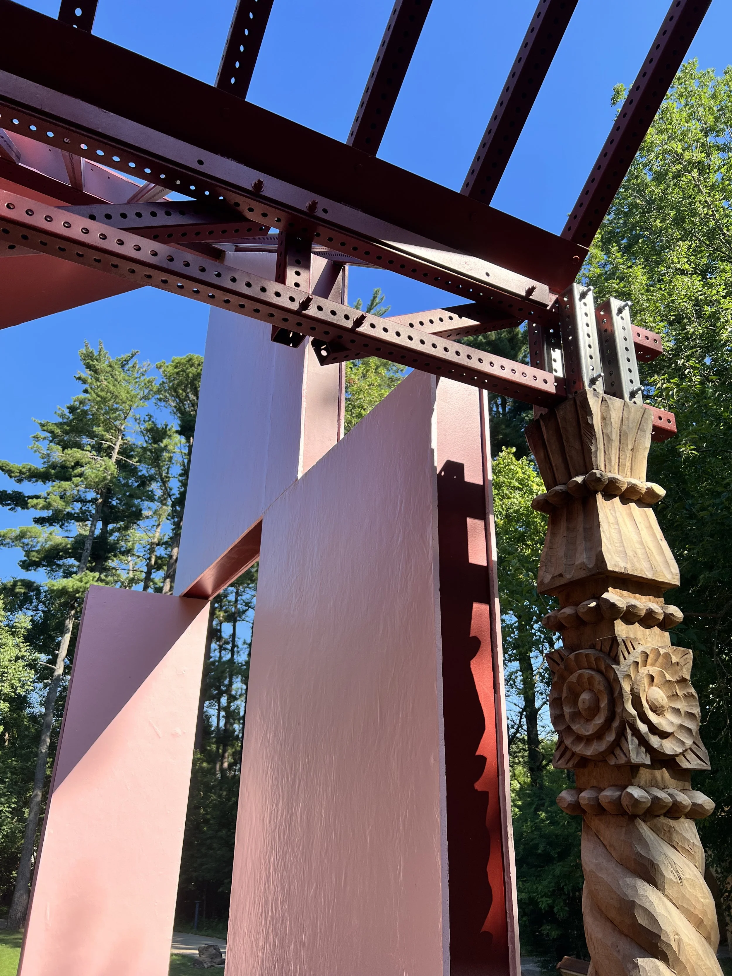 Pink panels, metal beams, hand carved indigenous Mexican totems.