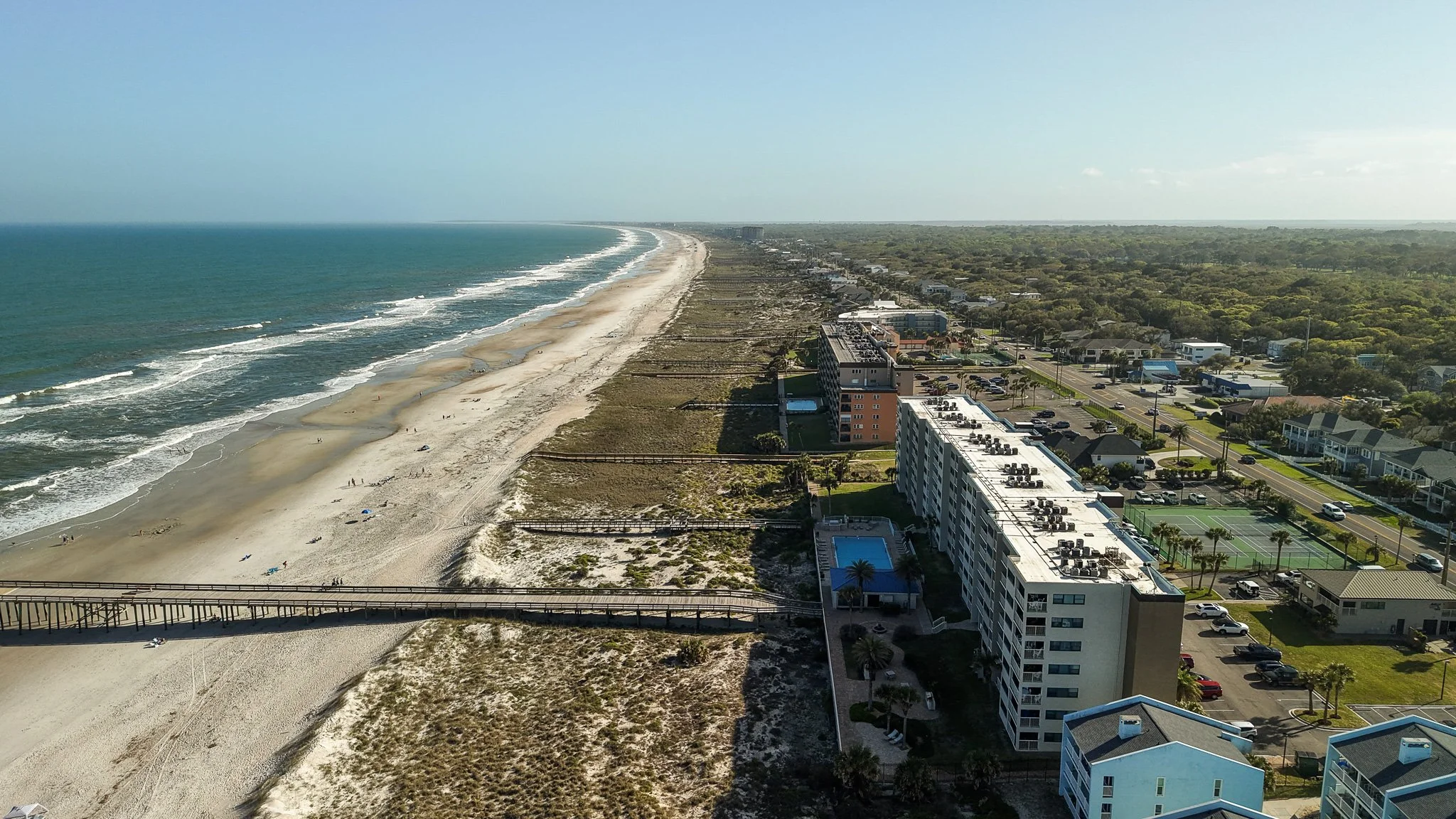 Aerial drone photography of beachfront condos and coastline in Fernandina Beach, Florida