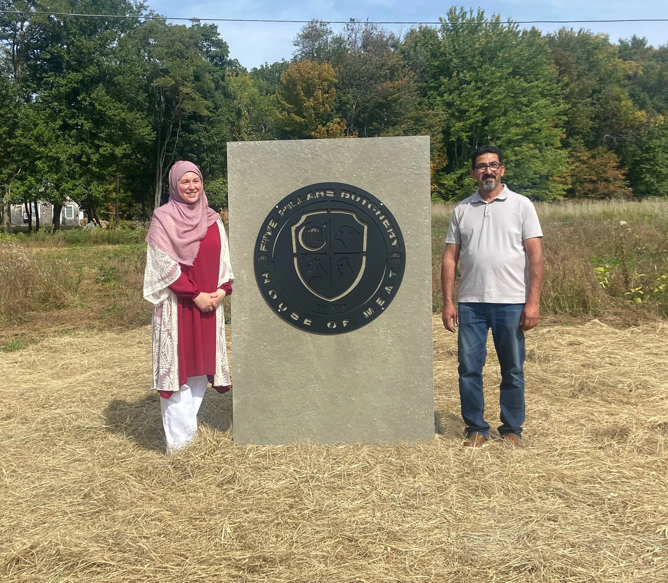 Five Pillars Butchery - Katherine and Hussam at facility sign