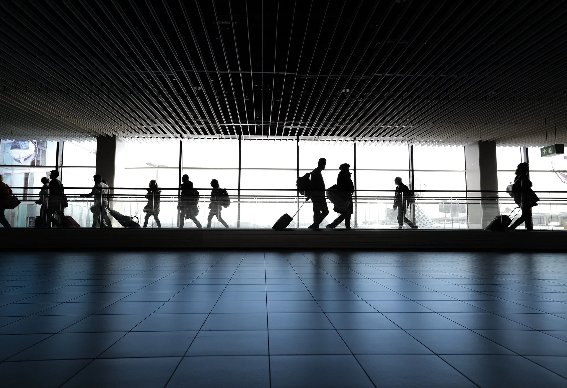People walking in front of a window