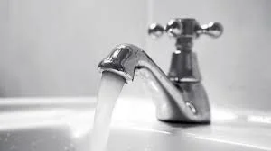 Running water from a bathroom faucet