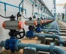 Industrial pipes and valves in a factory setting.