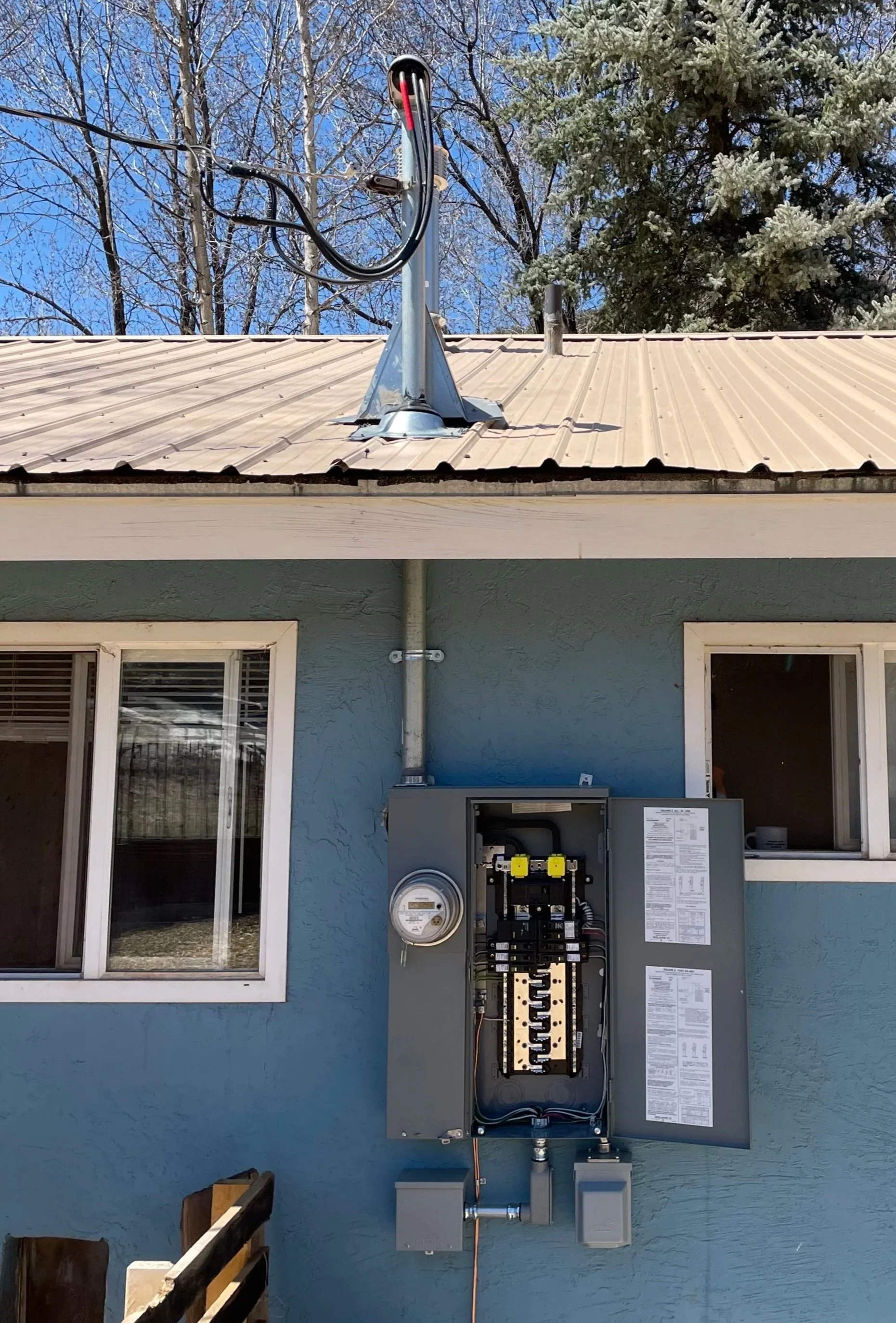 Service upgrade with roof penetration for riser.