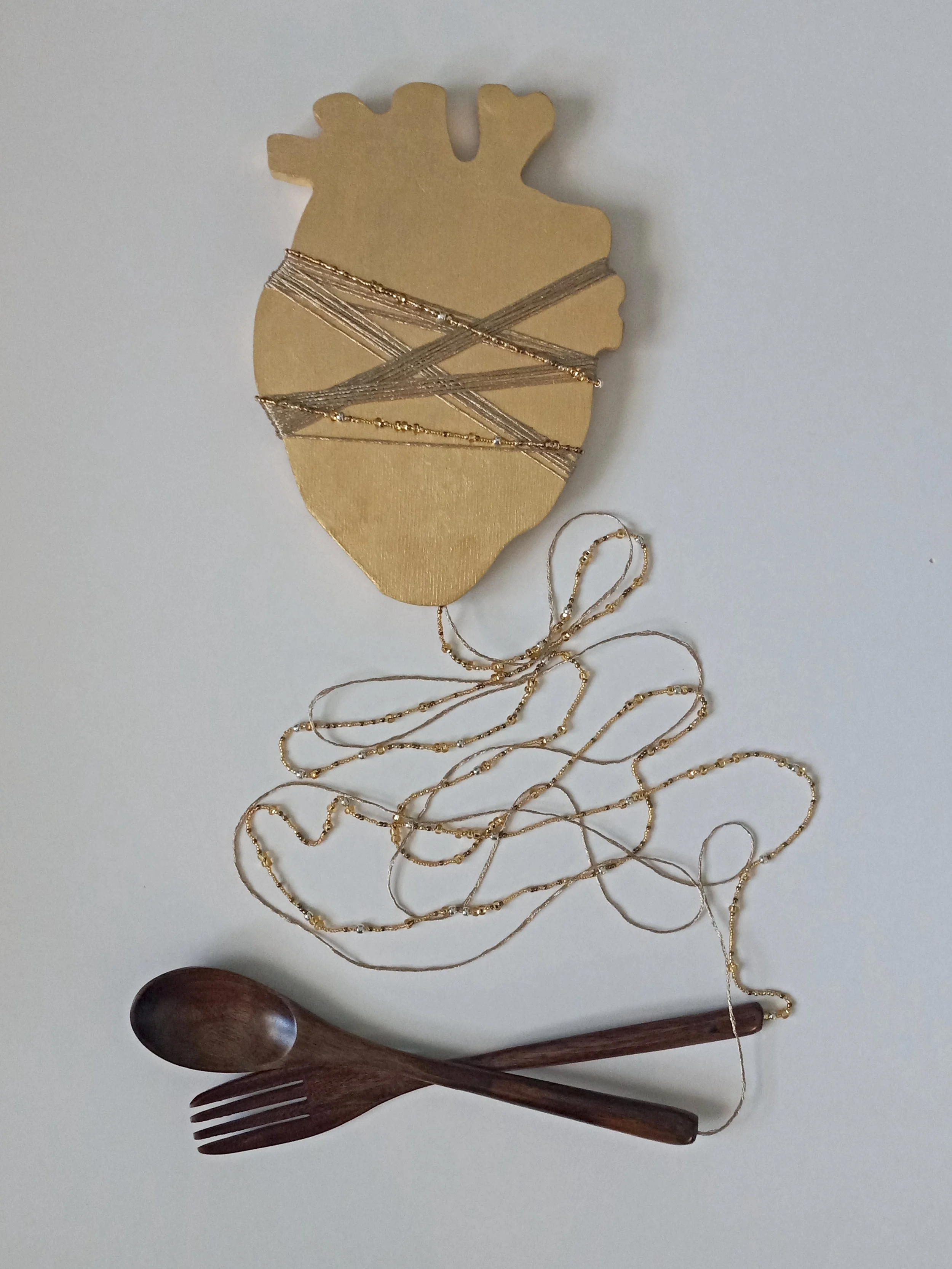 Phantom Pains. 2023; genuine gold leaf, birch panel, varnished wood, seed beads, metallic thread.