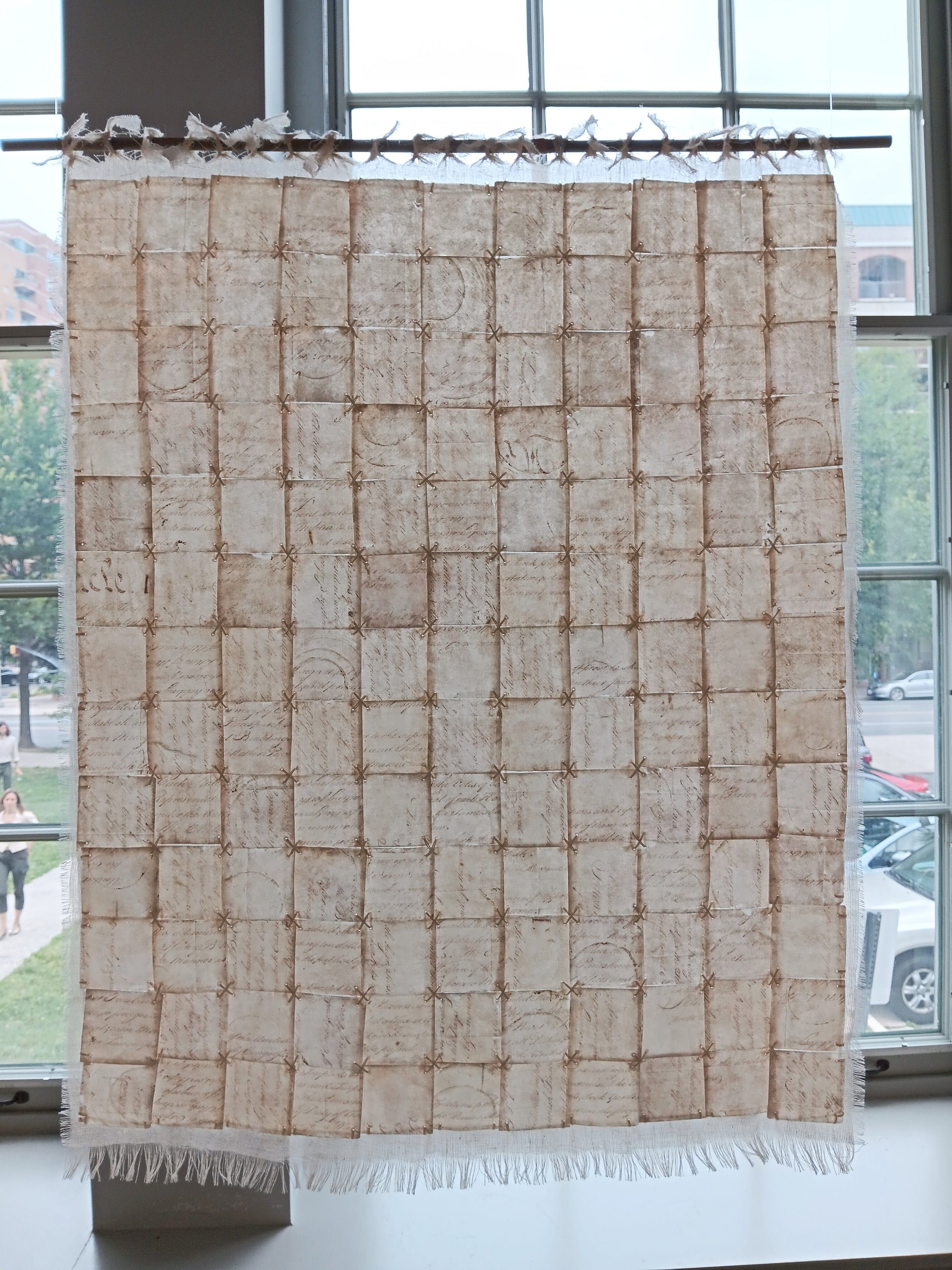 Liberté, Égalité, Fragilité (Page II). 2026; capiz, image transfer, cotton scrim, silk embroidery thread; 26"h x 22"w.