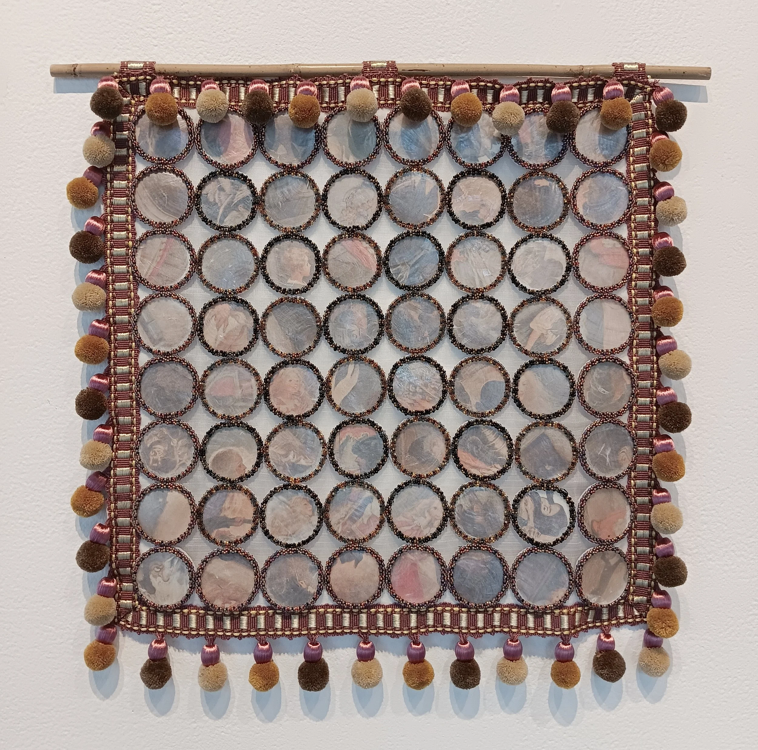 But that is the way fear serves us. 2026; capiz shells, illustrations by Jessie Willcox Smith, glass seed beads, felt, piña fabric, fabric trim, bamboo; 16"h x 16"w.