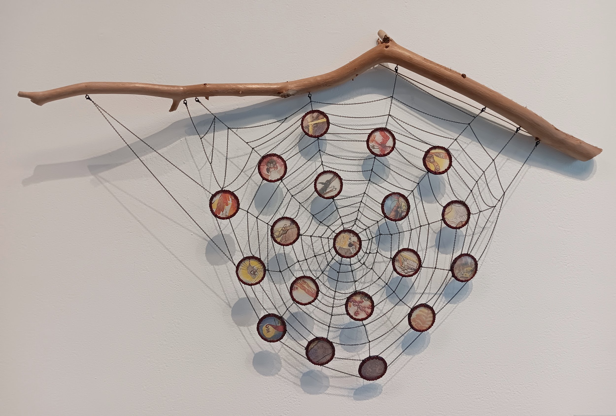 Architecture of Belief. 2026; capiz, fairytale illustrations by Zdeňka Krejčová, Czech glass seed beads, felt, chains, driftwood; 21"h x 34"w x 4"d.