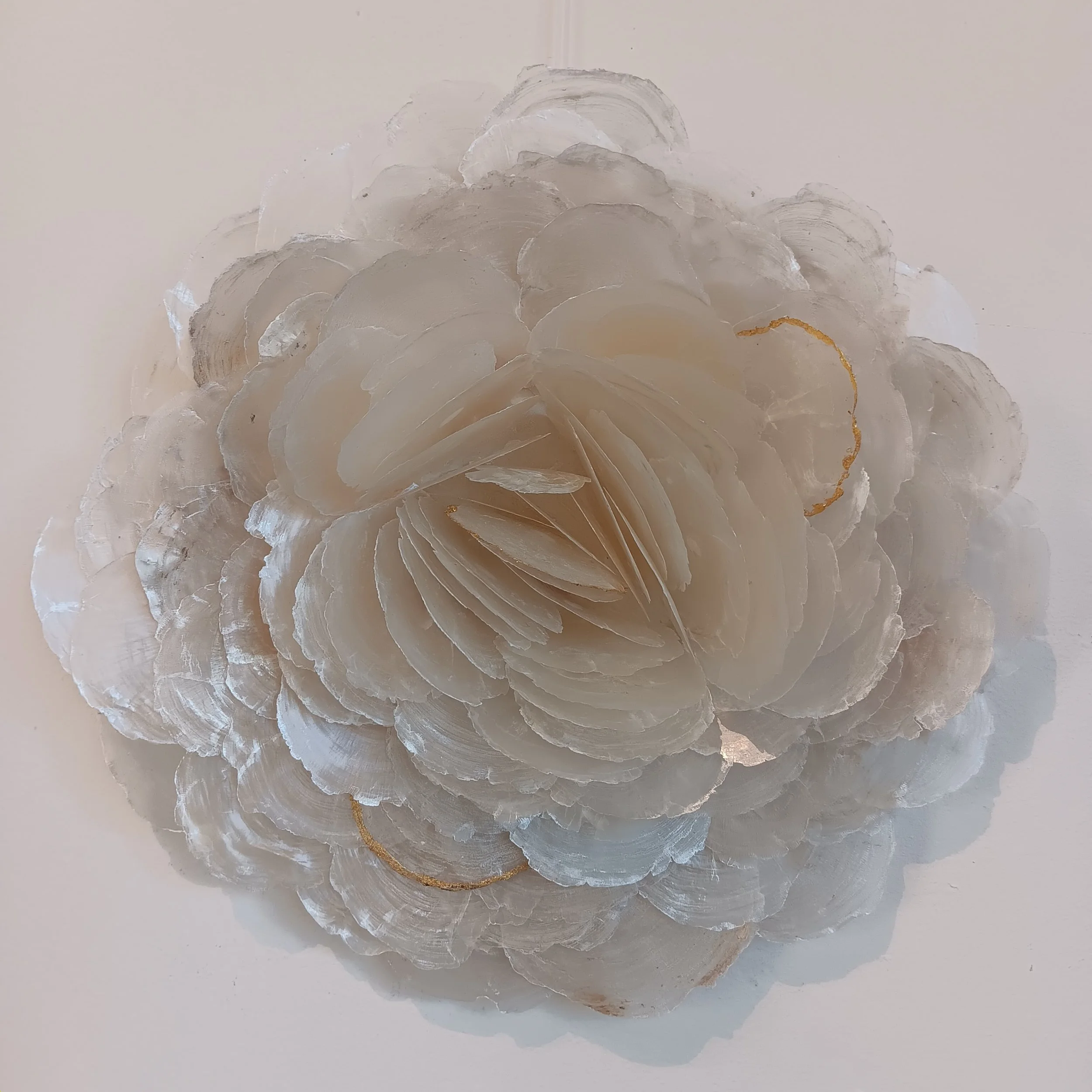 A Body Made of Breakers III. 2025; capiz shells, birch panel, genuine gold leaf; 14.5"h x 15"w x 4"d.