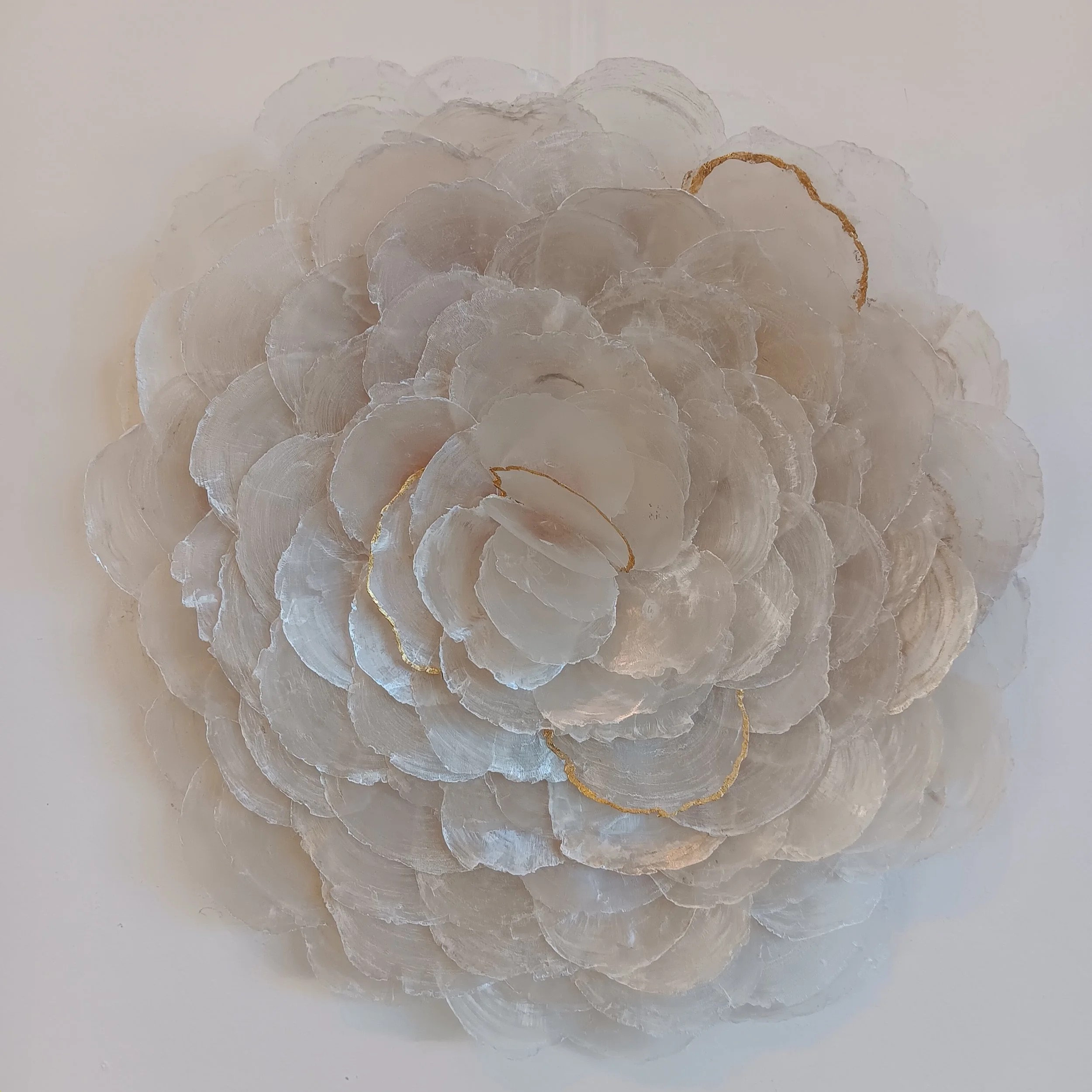A Body Made of Breakers II. 2025; capiz shells, birch panel, genuine gold leaf; 17"h x 15"w x 2.5" d.