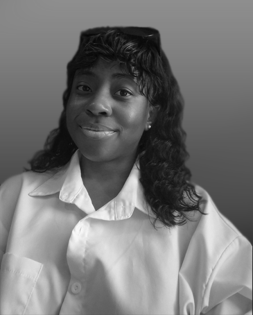 A woman wearing a white collared shirt, smiling slightly, in black and white.