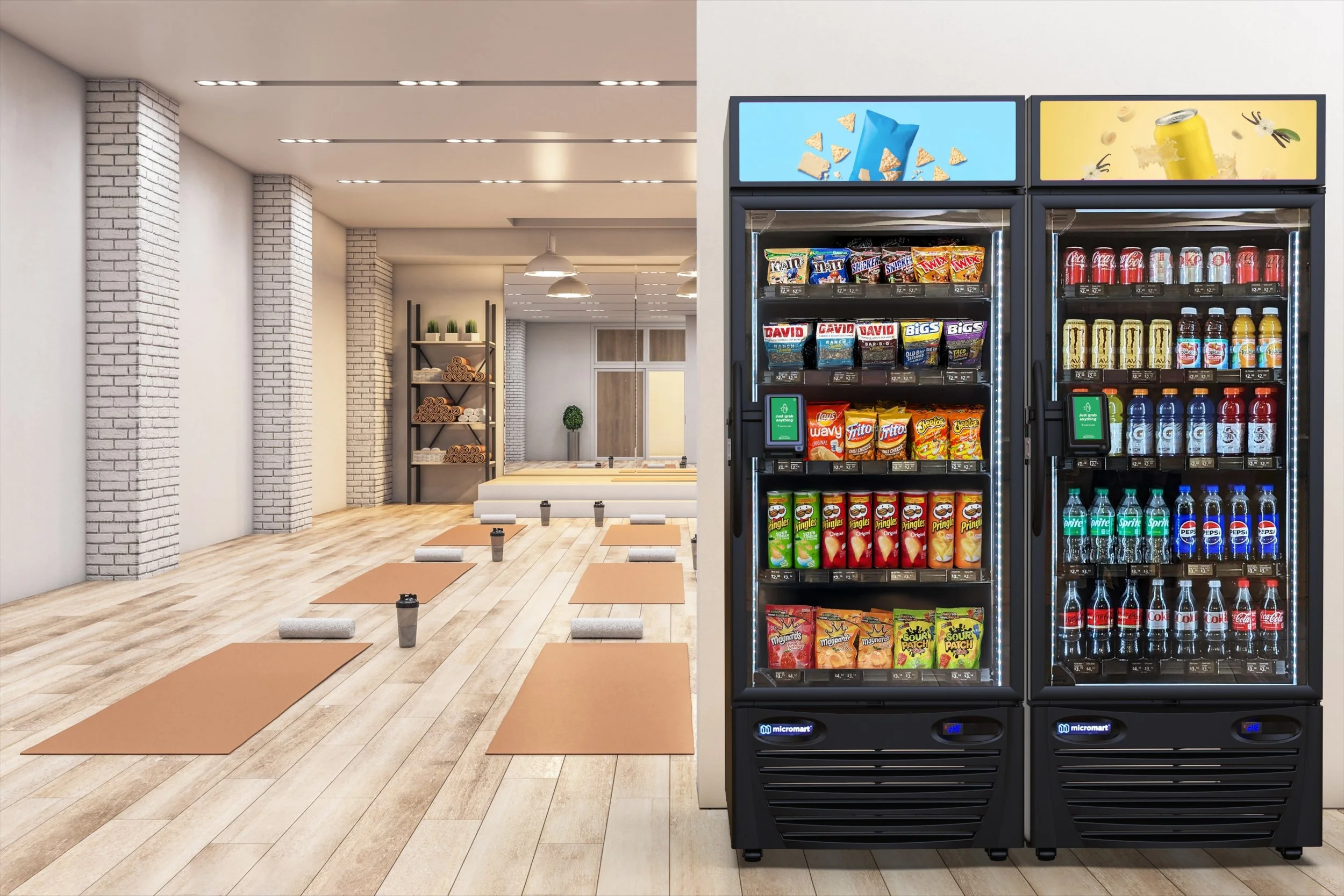 Vending machines with snacks and beverages in a yoga, fitness, or sports studio.