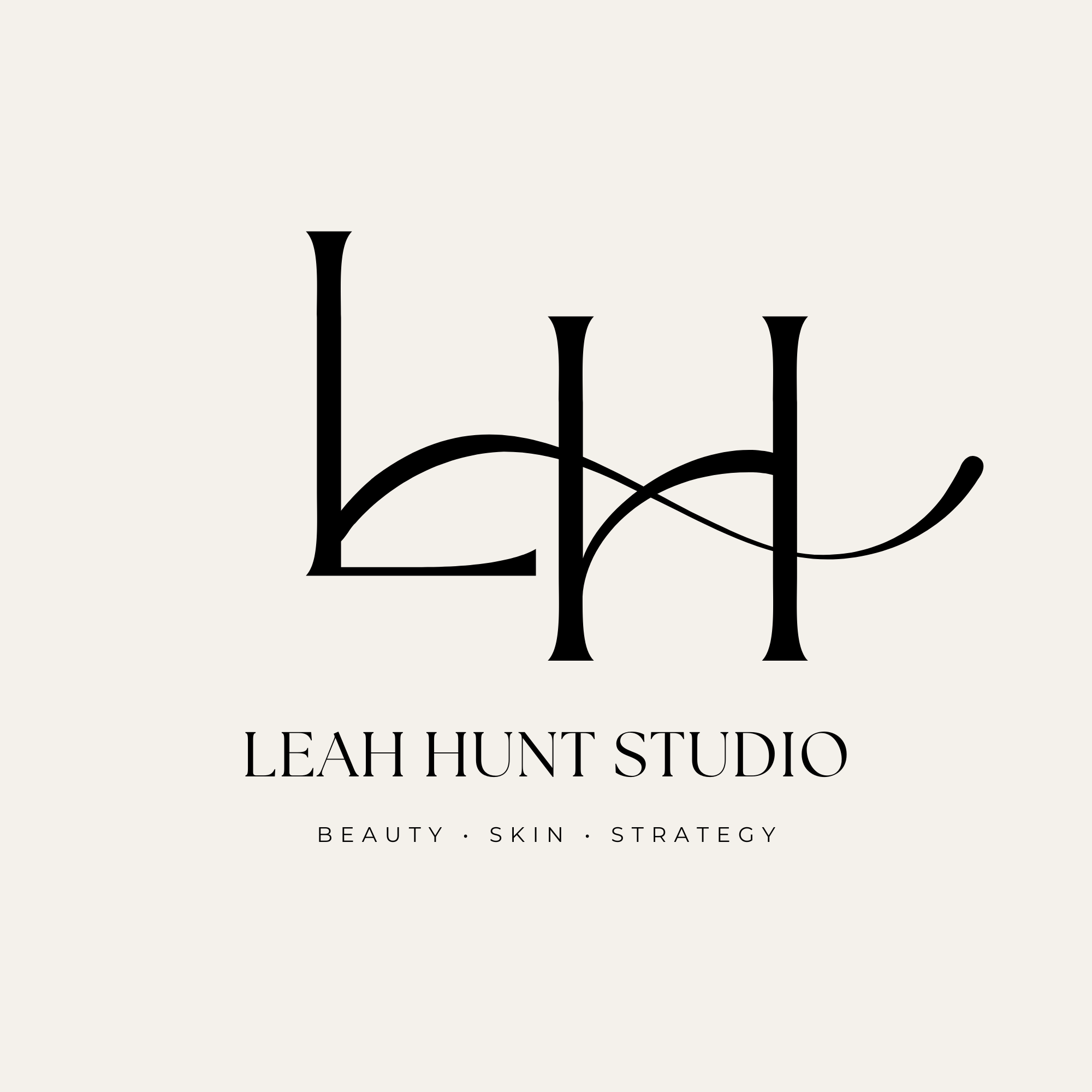 A logo for Leah Hunt Studio with black elegant cursive letters and the words "Beauty, Skin, Strategy" underneath.