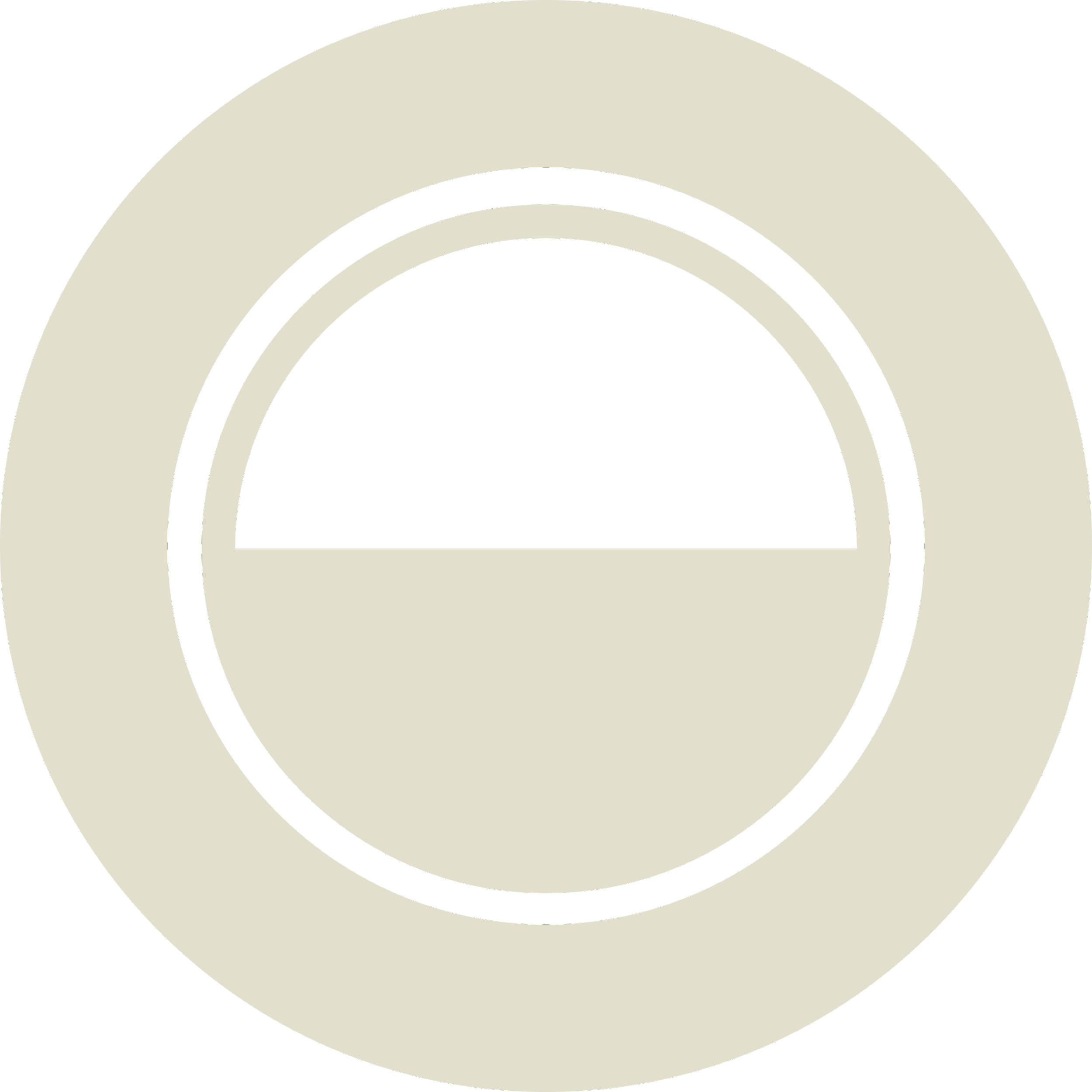 A close-up of a circular object with black and white concentric rings and a black rectangular hole in the center.