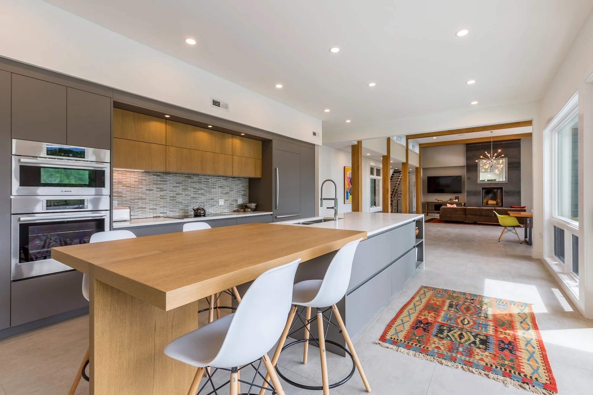 Modern kitchen and living room with a fresh coat of paint.