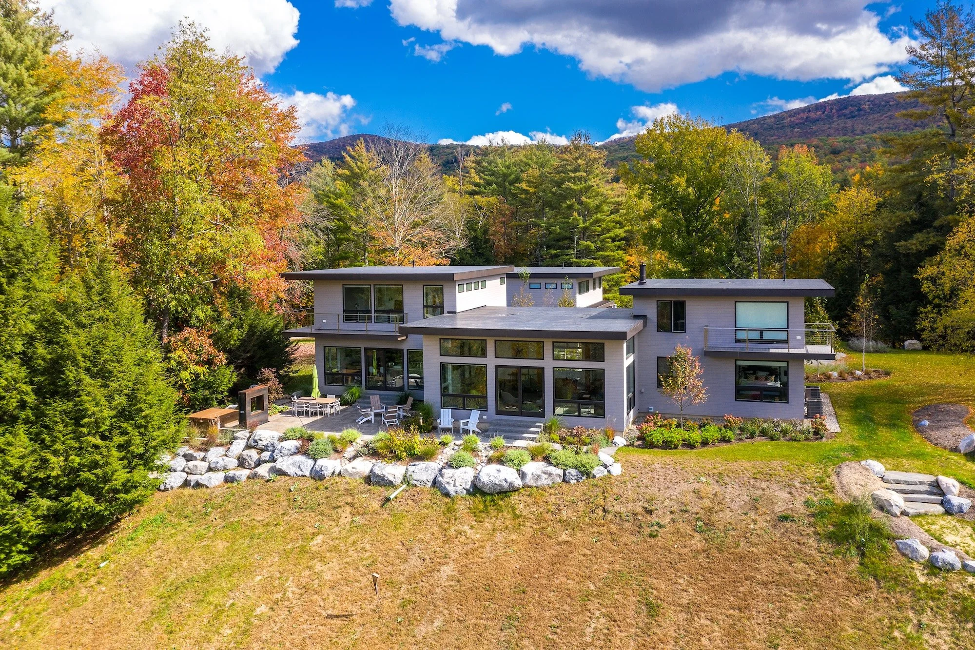 Exterior home painted grey in the mountains of Vermont.