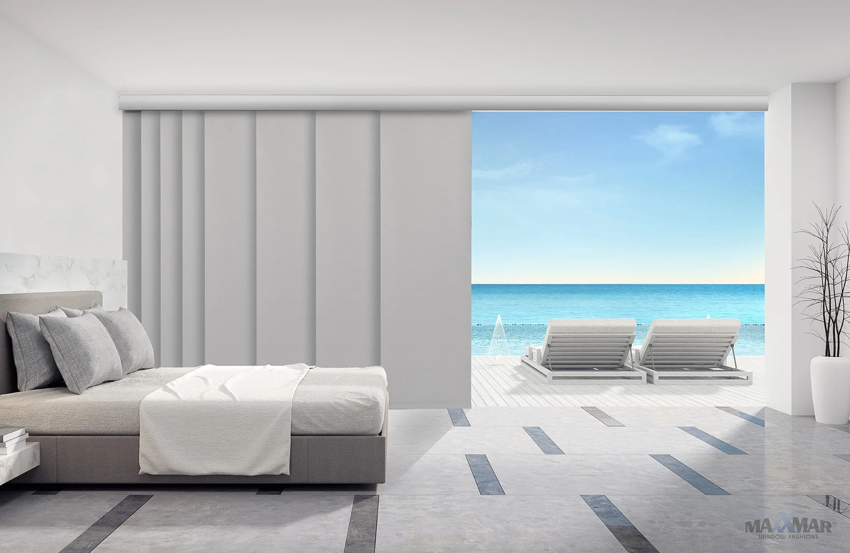 Modern bedroom with a view of the ocean through a large open sliding door, featuring beach chairs on a deck and bright blue water and sky outside.