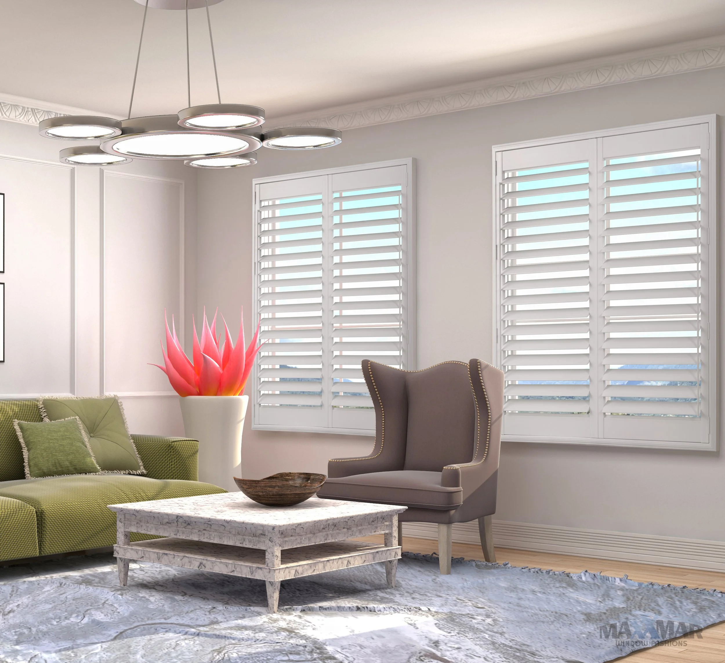 Modern living room with white walls, white plantation shutters on windows, a green sectional sofa with pillows, a gray high-back armchair, a white stone coffee table with a wooden bowl, a large pink flower sculpture in a white pot, and a ceiling light fixture.