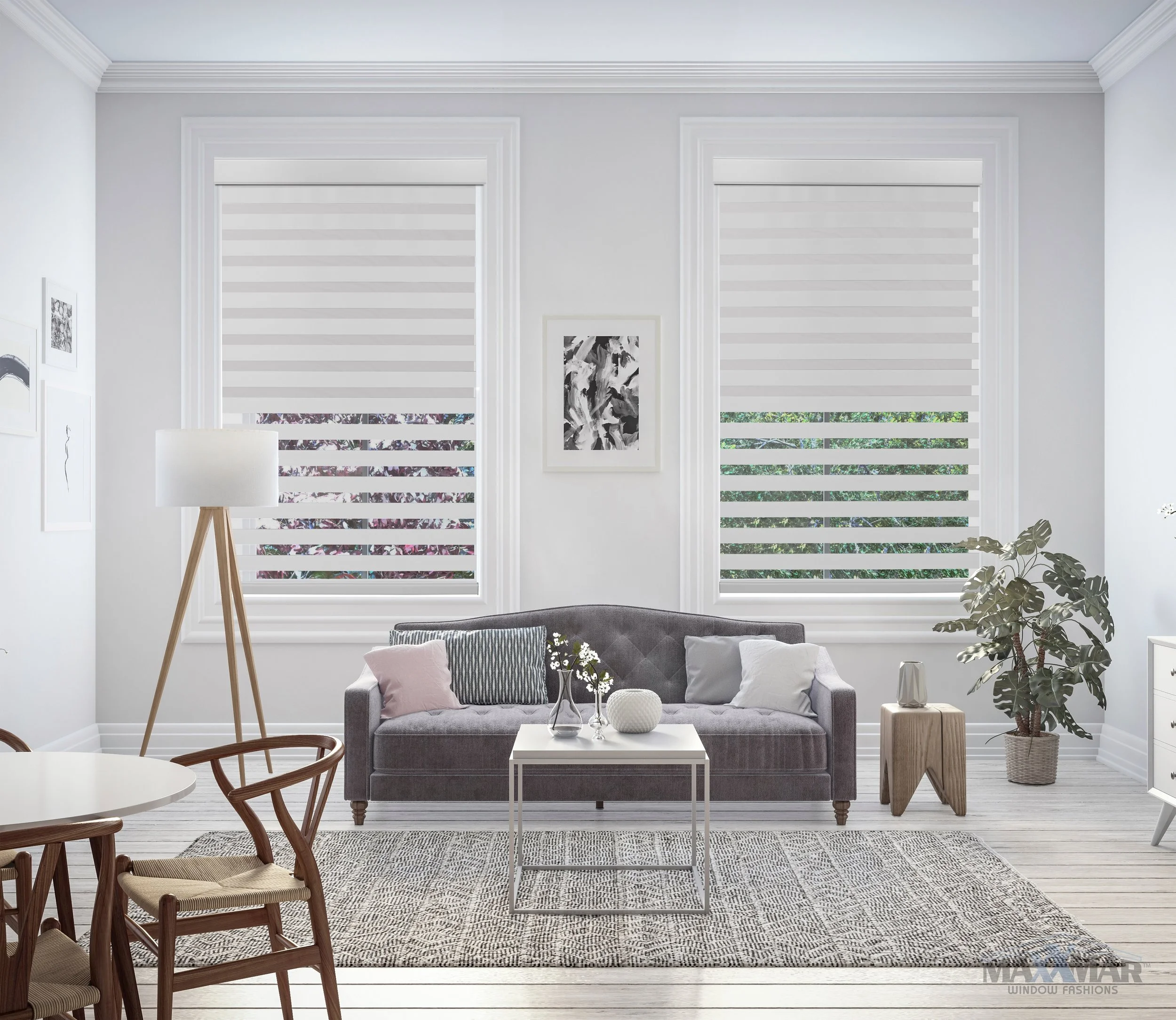 Modern living room with two large windows with horizontal blinds, a gray sofa with striped and plain pillows, a white coffee table with vases, a wooden side table, a large potted plant, a wooden floor lamp, and artwork on the white walls.