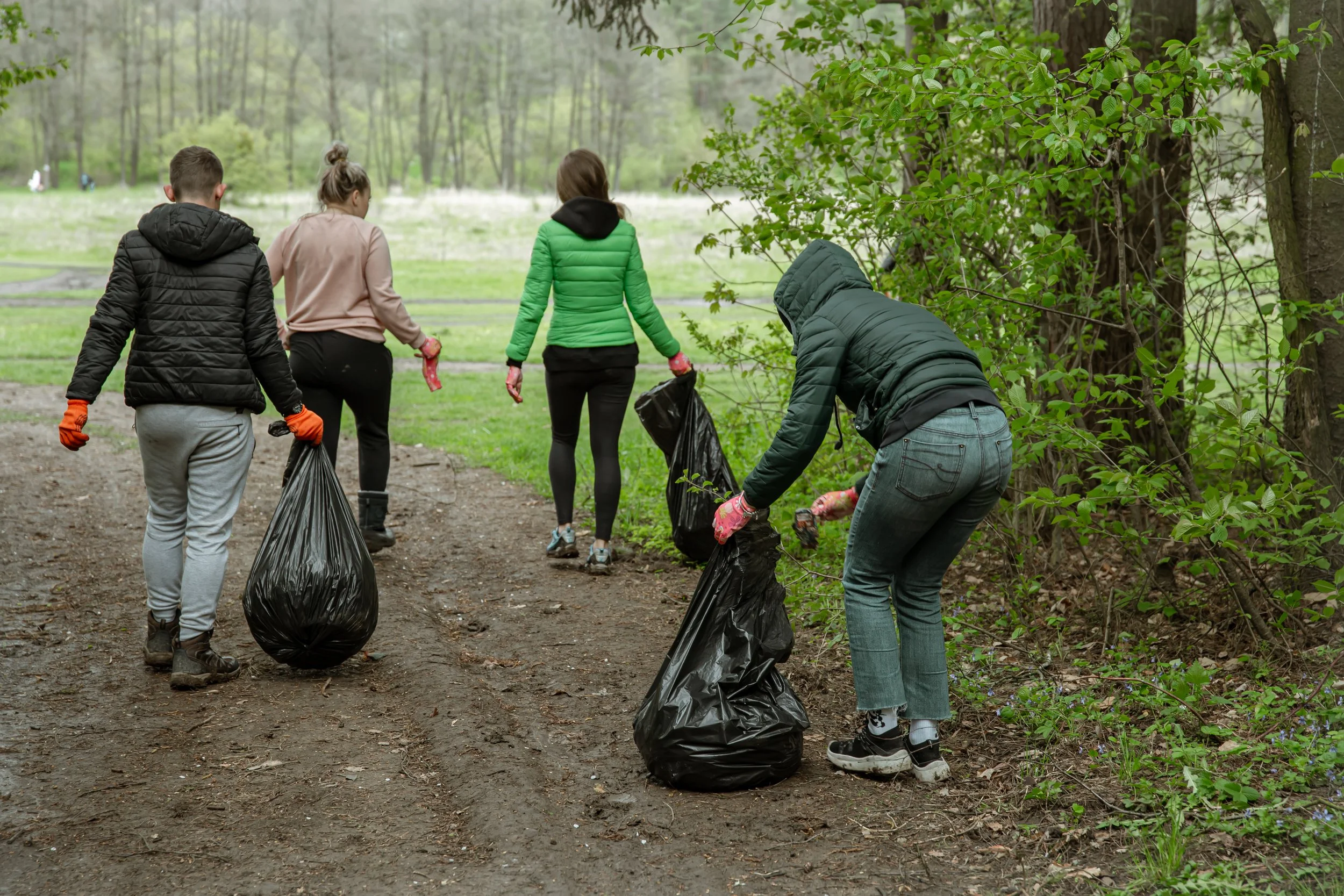 volunteers-with-garbage-bags-trip-nature-clean-environment.jpg