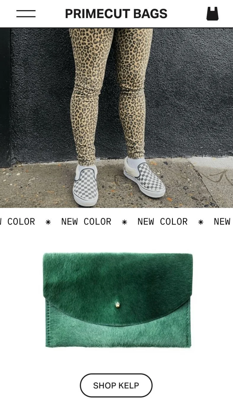 A person wearing leopard print pants and checkered slip-on shoes standing against a black textured wall. Below, there is a green fur clutch bag with a button clasp and a shop button labeled "Shop Kelp."