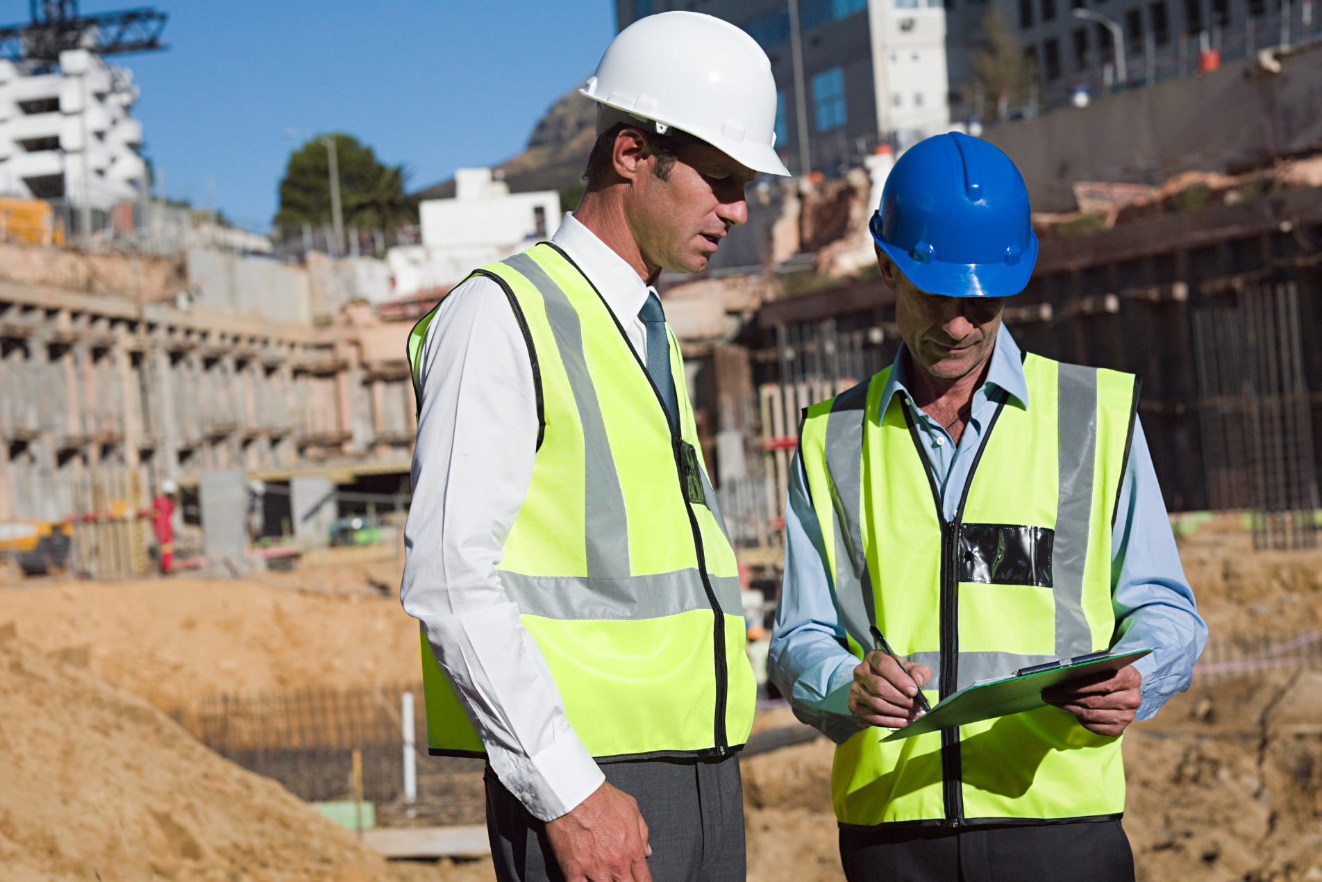 Construction workers wearing PPE on site