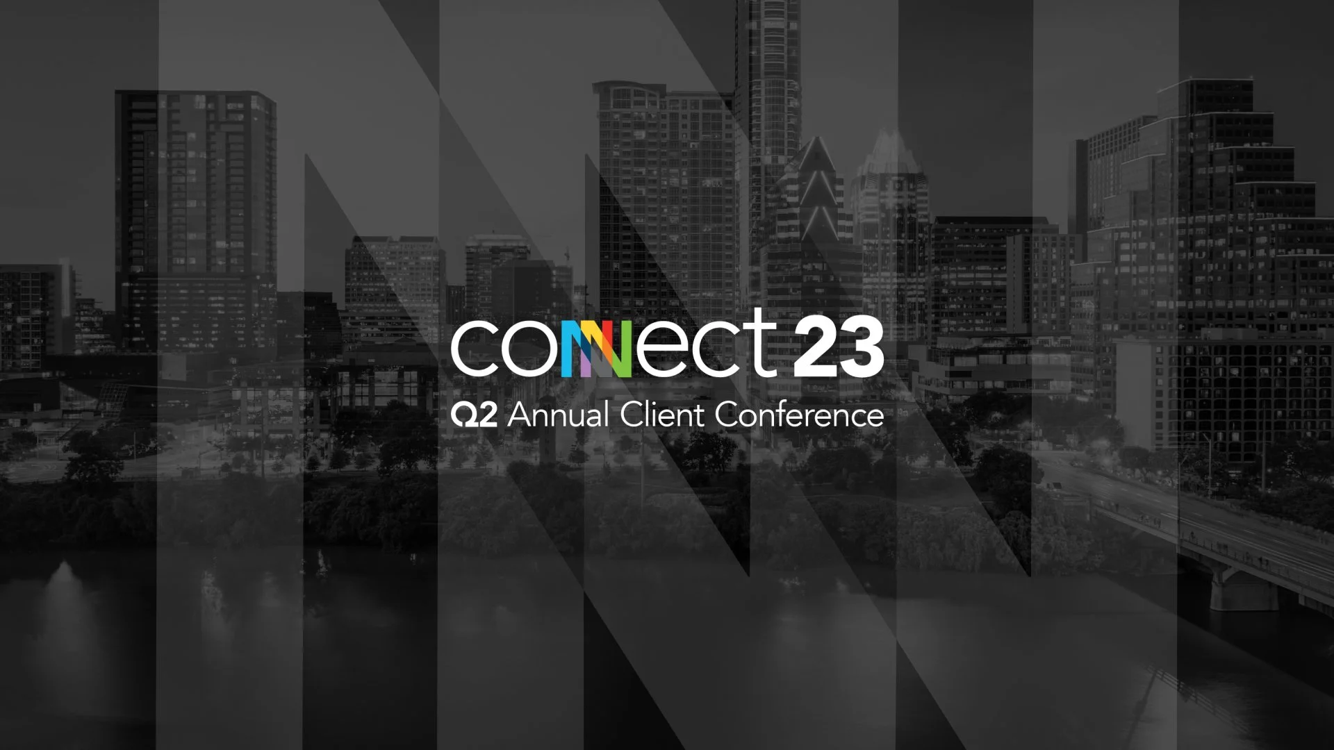 Black and white city skyline with high-rise buildings and a river in the foreground, overlaid with text 'connect23 Q2 Annual Client Conference'.