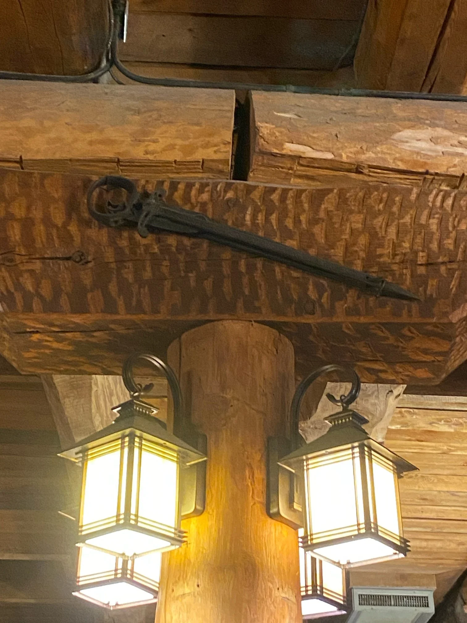 Kittyhawk Ski Club.  Wooden ceiling with two hanging lanterns and a sword mounted on the ceiling beam.