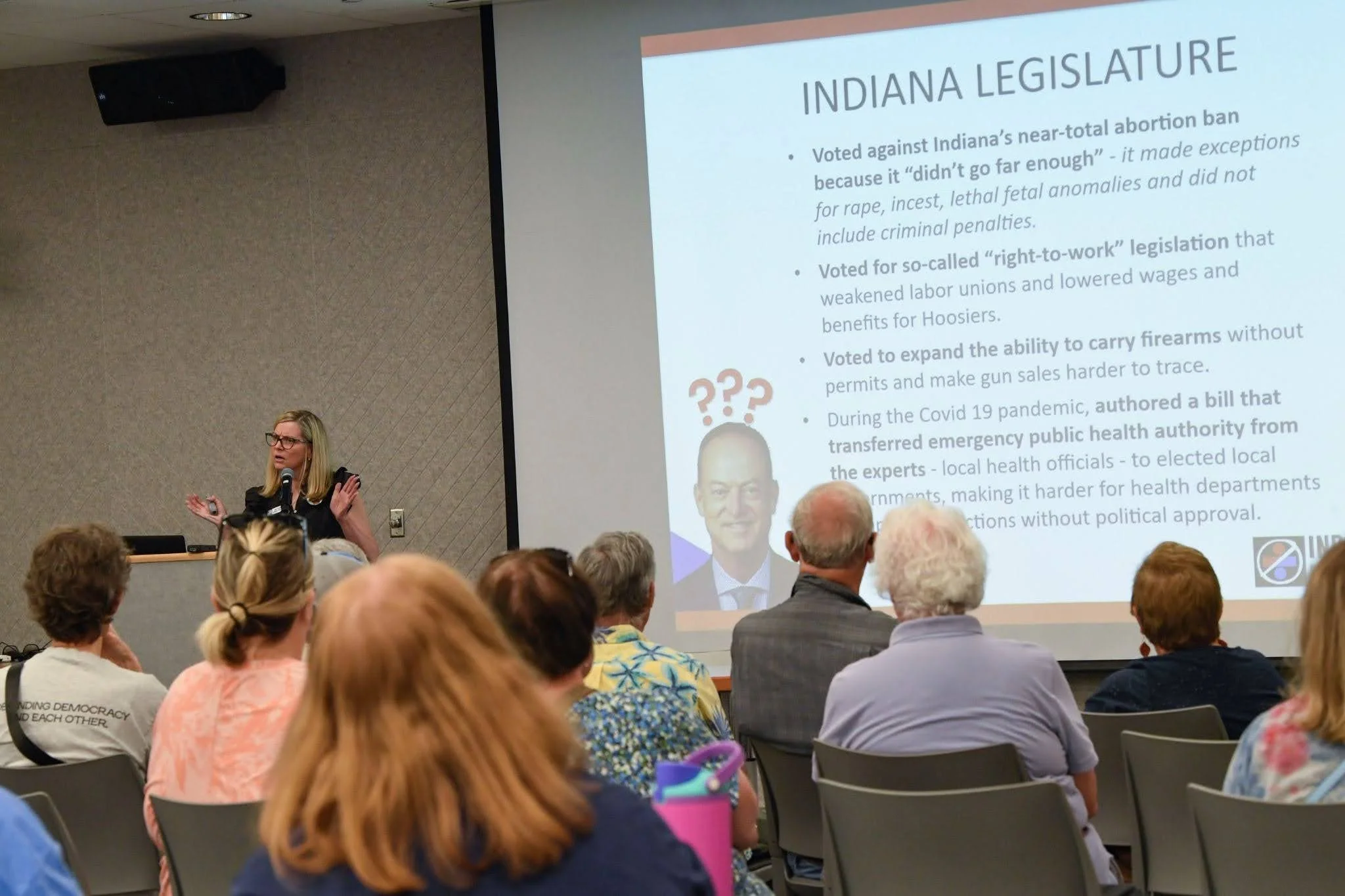 Indivisible President Wendy Bredhold presents on Mark Messmer's voting record in the Indiana Legislature