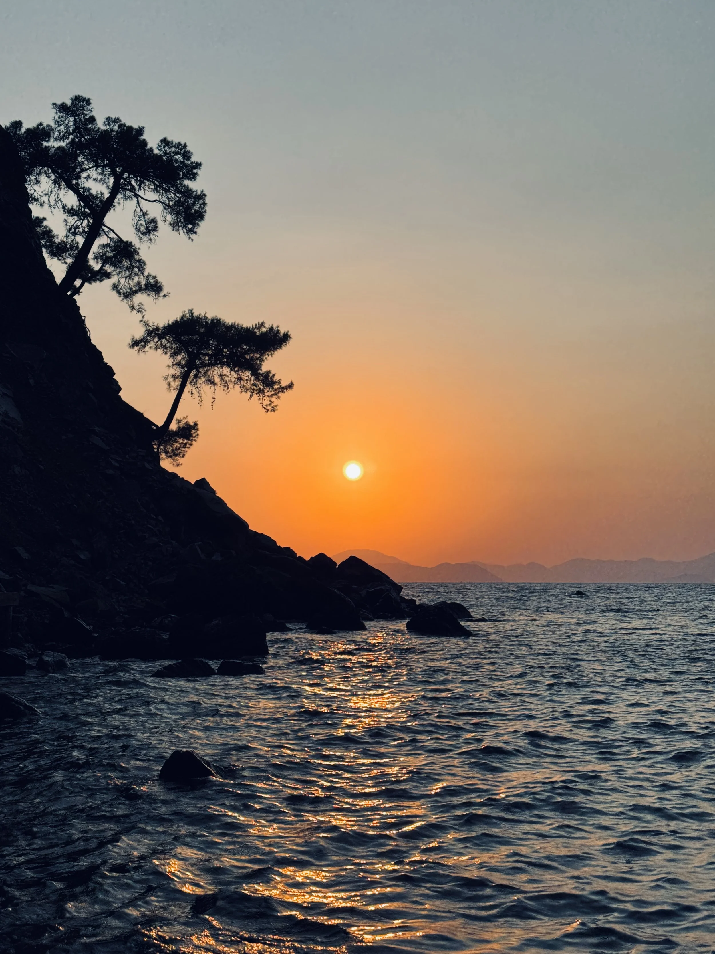 Sunset over the Mediterranean coast in Türkiye during a refined luxury travel experience
