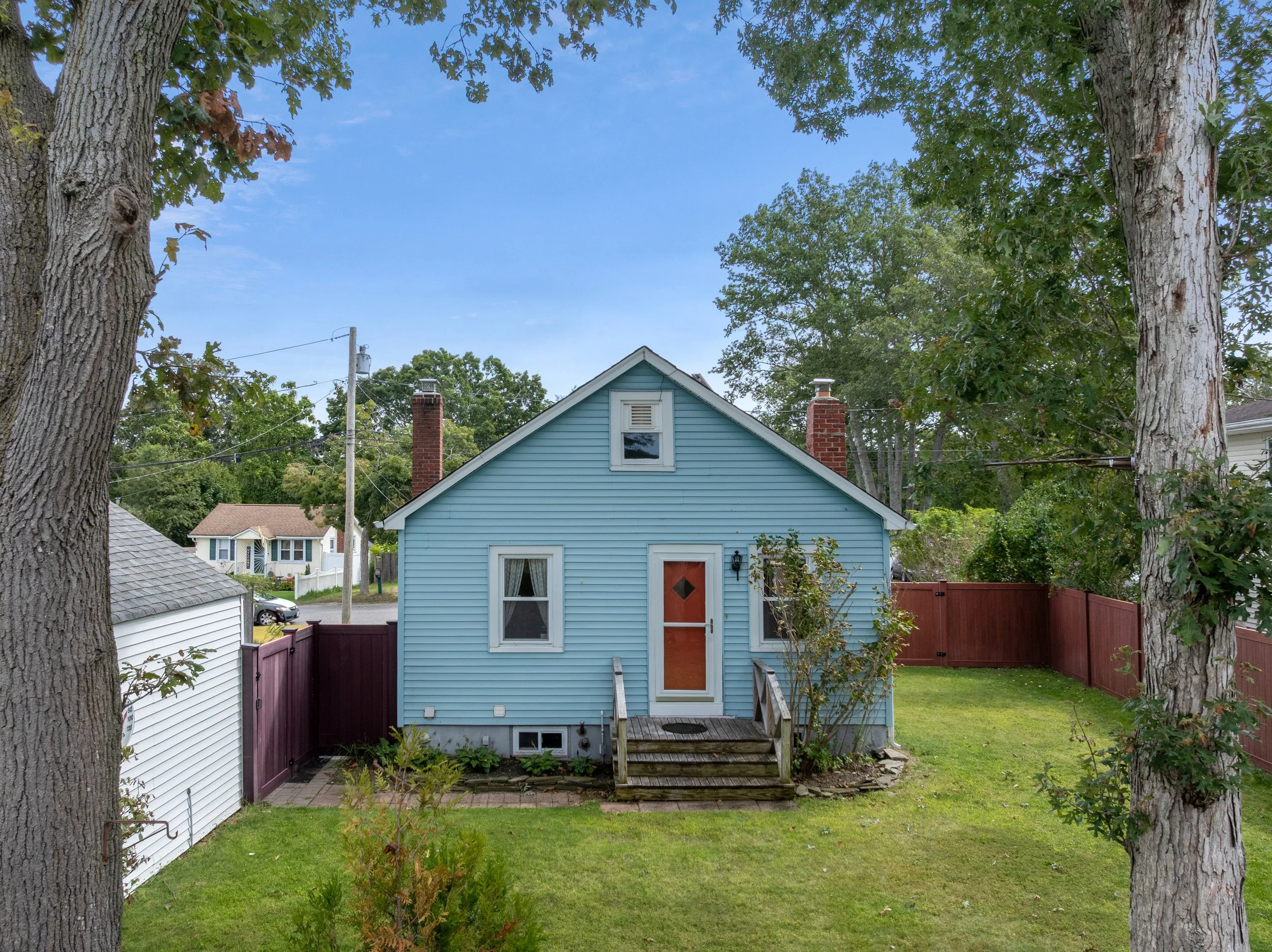 Backyard with green grass and garage, 50 Denton St. Patchogue, NY