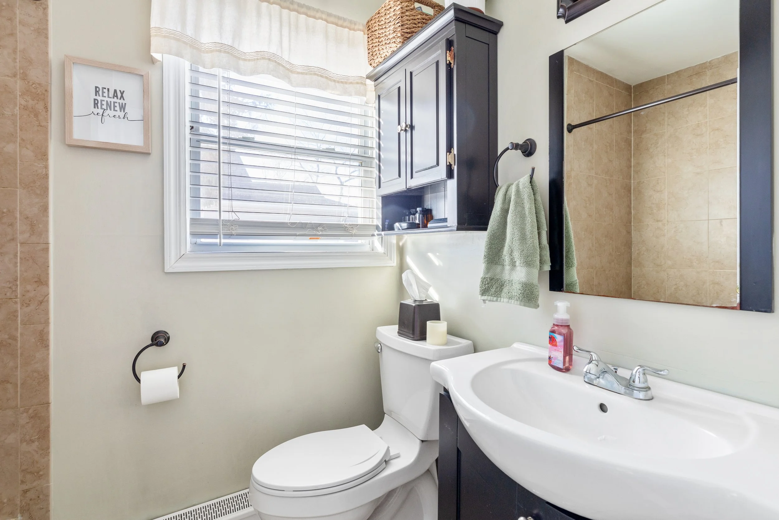 bathroom with sink and shower, 46 Rowland St. Patchogue, NY