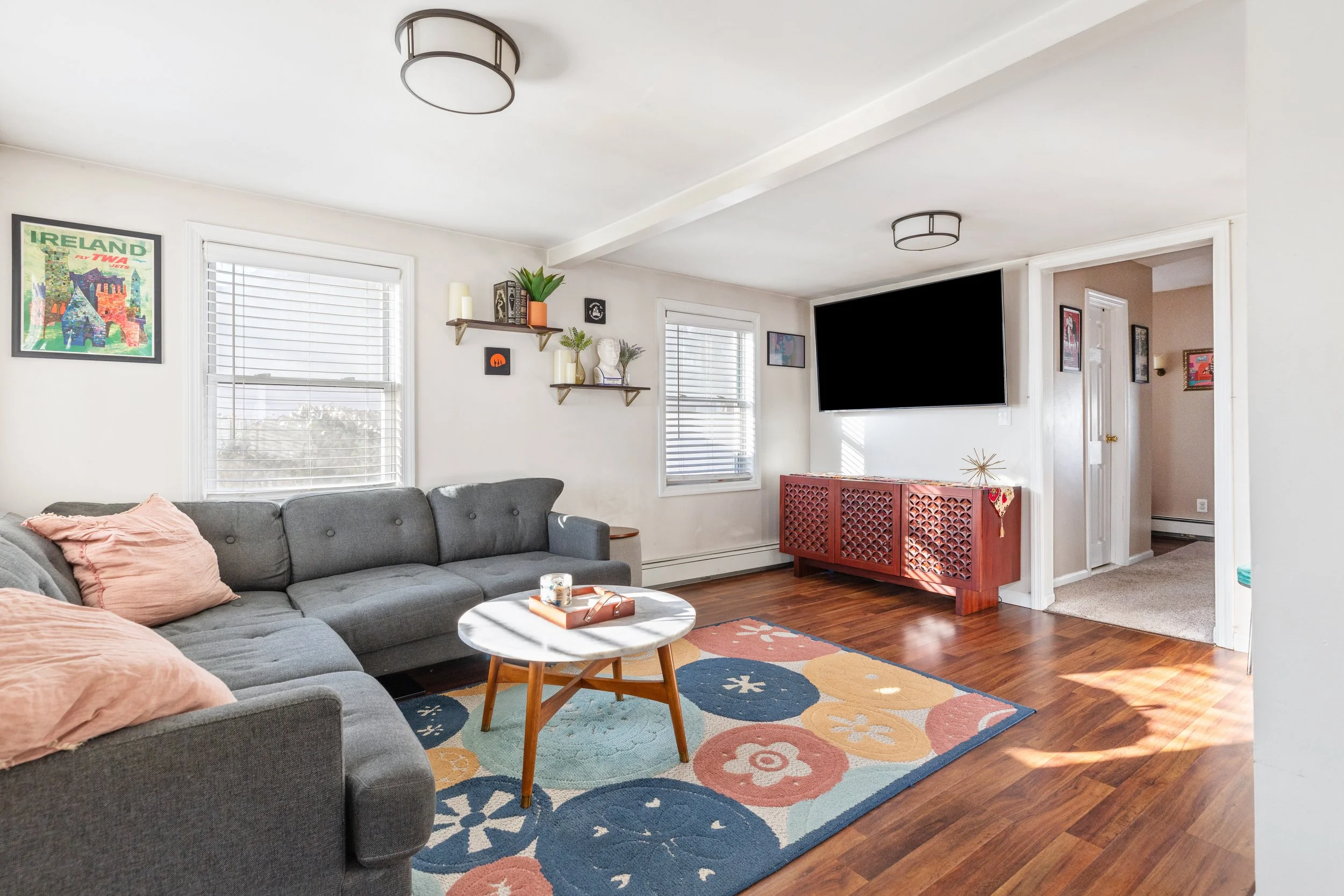 Living room with natural light and wood floors, 46 Rowland St. Patchogue, NY