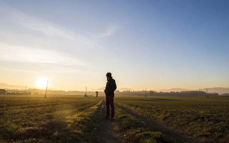Person standing in a rural area