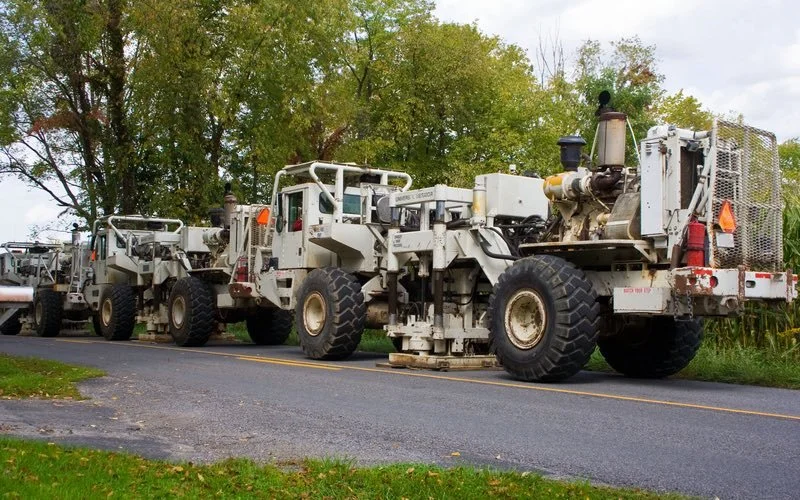 Seismic trucks on a road