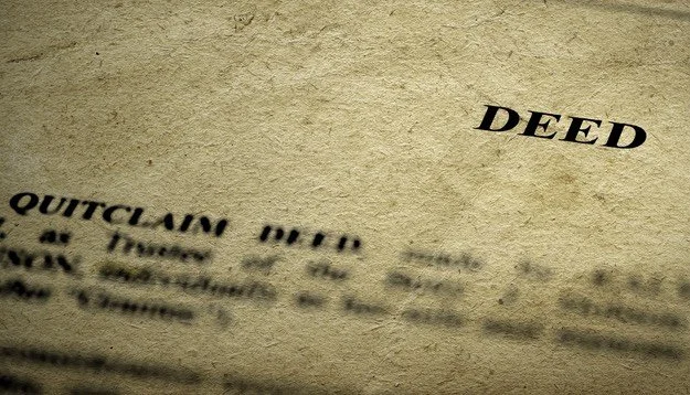 Top part of an old quitclaim deed