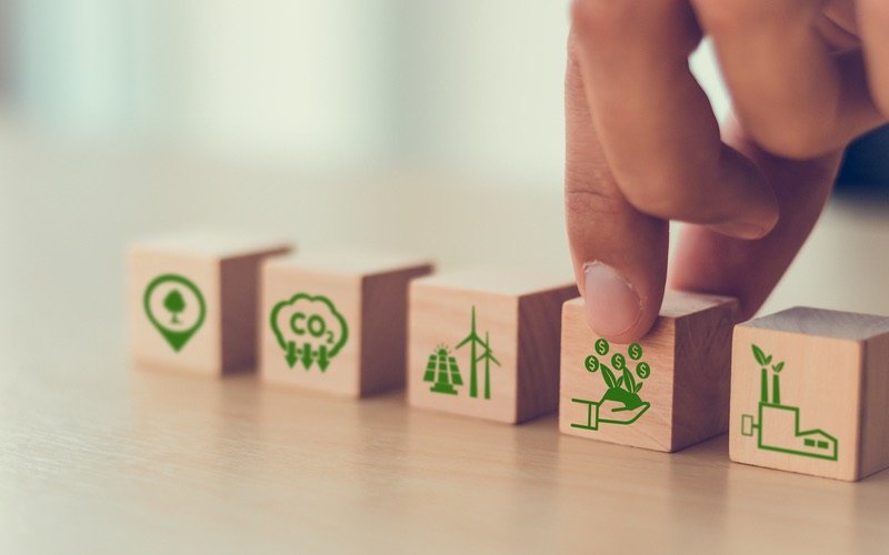 Hand placing environmental blocks in place