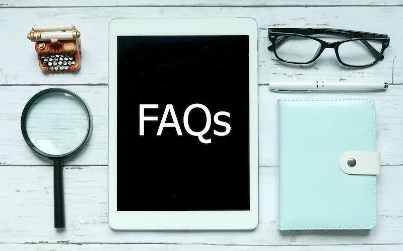 Blue desk with FAQs tablet