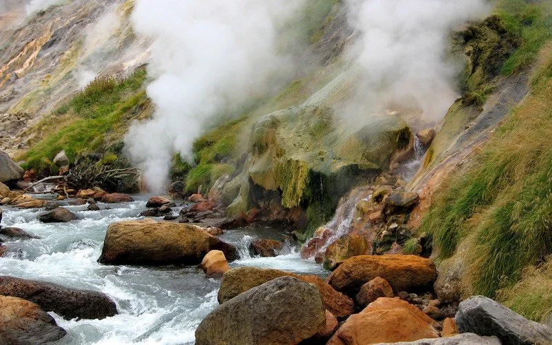 Stream next to steam clouds