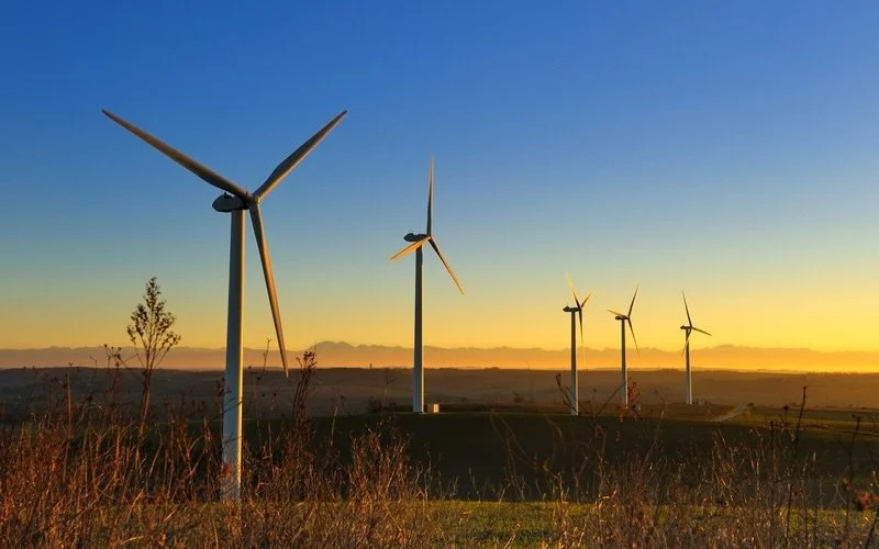 Windmills in a scenic landscape